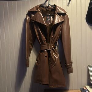 Vintage fur lined 100% vinyl jacket. Brown. Woman size medium.Missing one button